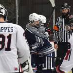 Soldotna junior David Aley is congratulate by teammates Thursday evening after scoring on Kenai Central at the Kenai Multi-Purpose Facility. (Photo by Joey Klecka/Peninsula Clarion)
