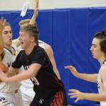 Kenai Centrals Andrew Bezdecny tries to break away from the Homer defense Friday, Dec. 21, 2018, at the Homer High School Alice Witte Gym in Homer, Alaska. (Photo by Michael Armstrong/Homer News)