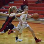 Juneaus Sadie Tuckwood races after Kenais Jaycie Calvert (right) Feb. 24, 2018, at Kenai Central High School. (Photo by Joey Klecka/Peninsula Clarion)