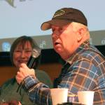 Al Poindexter addresses the crowd at a presentation of Homestead Kids: Tales from the North Fork on Thursday, Dec. 13, 2018 at the Alaska Islands and Oceans Center in Homer, Alaska. (Photo by Megan Pacer/Homer News)