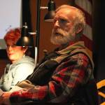 Lynn Whitmore moderates Homestead Kids: Tales of the North Fork, a presentation held Thursday, Dec. 13, 2018 at the Alaska Islands and Oceans Visitor Center in Homer, Alaska. (Photo by Megan Pacer/Homer News)