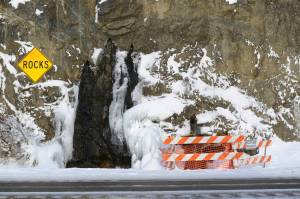 In this Dec. 21 photo the highway littered with rockfall south of Anchorage. (Anne Raup/Anchorage Daily News via AP)