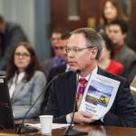 Commissioner Designee Bruce Tangeman presents the states revenue forecast to the Senate Finance Committee at the Capitol on Wednesday, Jan. 16, 2019. (Michael Penn | Juneau Empire)