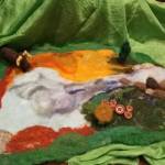 Hanna Youngs story apron with some of her felted figures. (Photo provided)