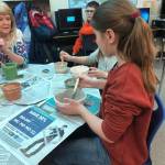 Fifth-graders at Soldotna Elementary school worked on pottery projects with Debbie Adamson, president of the Kenai Potters Guild, for a fundraiser that will buy new playground equipment for the school on Thursday, in Soldotna. (Photo by Victoria Petersen/Peninsula Clarion)
