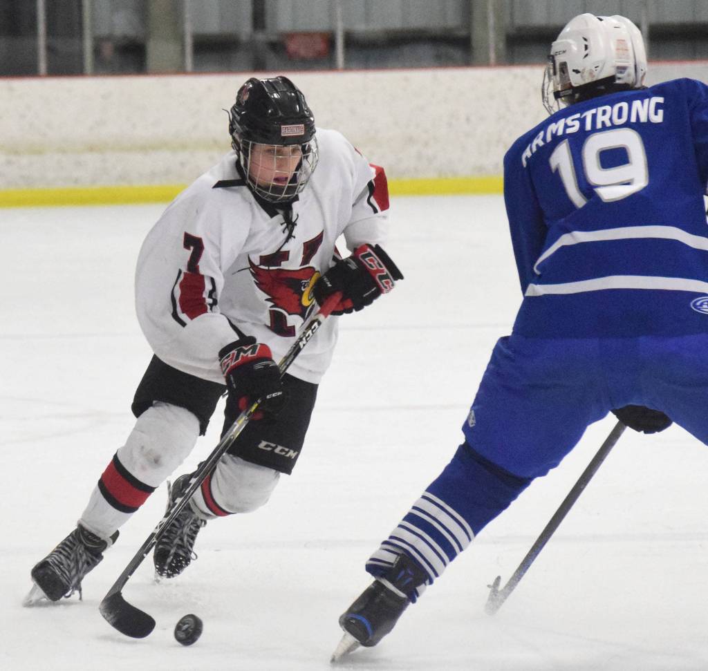 Kenais Jacob Begich (left) looks for a way around Palmers Easton Armstrong Friday night at the Kenai Multipurpose Facility. (Photo by Joey Klecka/Peninsula Clarion)