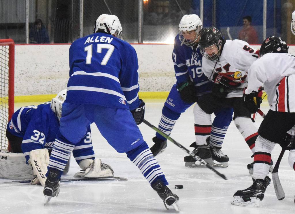 Kenais Zach Burnett (5) eyes the puck in a opportunistic situation Friday night against Palmer at the Kenai Multipurpose Facility. (Photo by Joey Klecka/Peninsula Clarion)