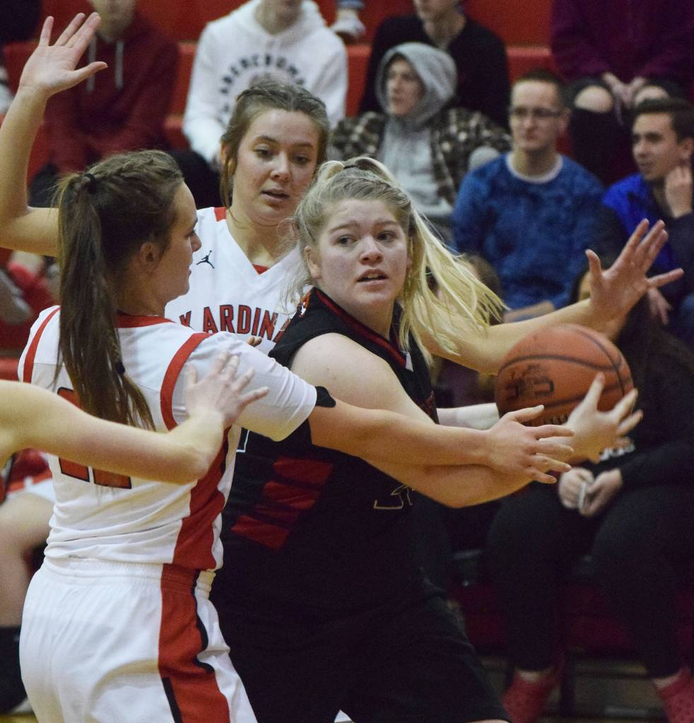 Houstons Emily Bitler (right) works against the Kenai press Saturday afternoon against the Houston Hawks at Kenai Central High School. (Photo by Joey Klecka/Peninsula Clarion)