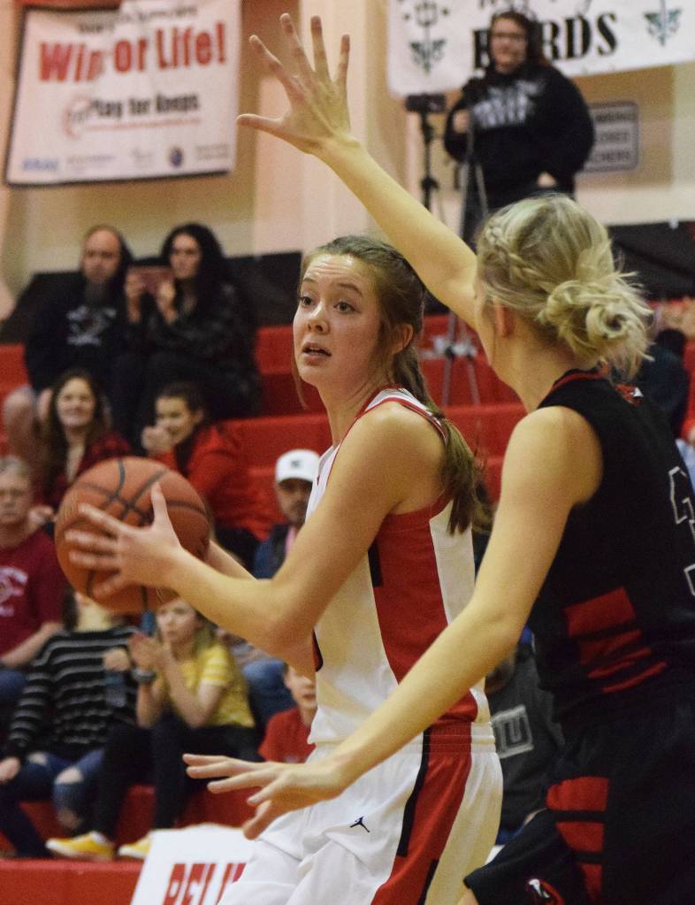 Kenais Brooke Satathite looks for an open teammate Saturday afternoon against the Houston Hawks at Kenai Central High School. (Photo by Joey Klecka/Peninsula Clarion)