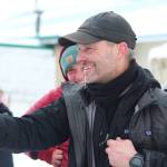 Musher Dave Turner celebrates just after winning this years Tustumena 200 Sled Dog Race on Sunday, Jan. 27, 2019 at Freddies Roadhouse finish line near Ninilchik, Alaska. (Photo by Megan Pacer/Homer News)