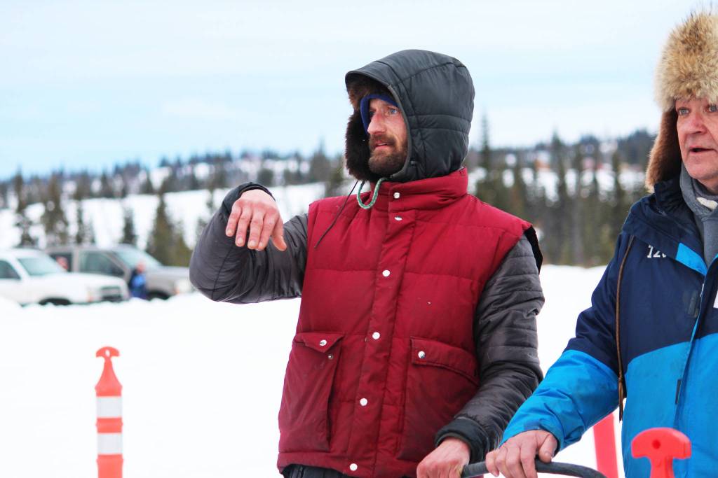 Nicolas Petit surveys the finish line of the Tustumena 200 Sled Dog Race just after coming in third place Sunday, Jan. 27, 2019 at Freddies Roadhouse in Ninilchik, Alaska. (Photo by Megan Pacer/Homer News)