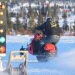 Freddie Pollard Jr. takes off during a heat race Saturday afternoon at the snowmachine drag races at Freddies Roadhouse near Ninilchik. (Photo by Joey Klecka/Peninsula Clarion)