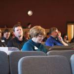 Attendees at this years Industry Outlook Forum take part in an electronic game on their phones designed to survey business owners about their level of disaster preparedness on Wednesday, Jan. 9, 2019 at Christian Community Church in Homer, Alaska. (Photo by Megan Pacer/Homer News)