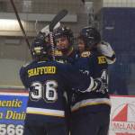 Homer skater Tyler Gilliland (center) celebrates with teammates after scoring a goal in the second period Tuesday night against Soldotna at the Soldotna Regional Sports Complex. (Photo by Joey Klecka/Peninsula Clarion)