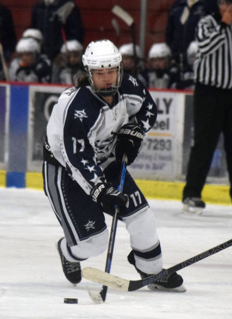 Soldotnas Wyatt Medcoff works the puck down the ice Tuesday night against Homer at the Soldotna Regional Sports Complex. (Photo by Joey Klecka/Peninsula Clarion)