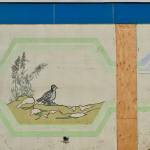 After construction workers removed siding from the facade of the Kenai Municipal Airport, a mural with iconic Kenai images like fishing nets, the St. Nicholas Russian Orthodox chapel and a dog musher, was revealed on Tuesday, Jan. 15, 2019 in Kenai, Alaska. (Photo by Victoria Petersen/Peninsula Clarion)