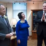 Sen. Mike Shower, R-Wasilla, left, and Sen. Shelley Hughes, R-Palmer, relay a message to Gov. Michael J. Dunleavy in his Capitol office that the Senate is open and ready for business on the first day of the 31st Session of the Alaska Legislature on Tuesday, Jan. 15, 2019. (Michael Penn | Juneau Empire)
