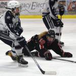 Kenais Jordyn Stock (right) watches a shot by Soldotnas Sam Skolnick Wednesday night in a conference game at the Soldotna Regional Sports Complex. (Photo by Joey Klecka/Peninsula Clarion)