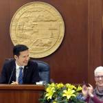 Democratic Alaska state Rep. Neal Foster, left, smiles after being elected temporary speaker of the House, Thursday, in Juneau. The House has yet to organize a majority and elect a permanent speaker. (AP Photo/Becky Bohrer)