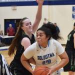 Soldotnas Ituau Tuisaula darts around Colonys Tori Schwantes Friday night at Soldotna High School. (Photo by Joey Klecka/Peninsula Clarion)