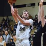 Nikiskis Cody Handley hits a hook shot Saturday against South at the Rus Hitchcock Nikiski Tip Off tournament. (Photo by Joey Klecka/Peninsula Clarion)