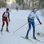 Kenai Centrals Summer Foster and Soldotnas Erika Arthur round a corner during Besh Cup 3 at Tsalteshi Trails on Sunday, Jan. 20, 2019. (Photo by Jeff Helminiak/Peninsula Clarion)