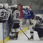 Soldotnas J.D. Schmelzenbach looks on as both teams huddle in a late timeout Friday in a state semifinal contest at the Curtis Menard Sports Complex in Wasilla. (Photo by Joey Klecka/Peninsula Clarion)