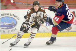 Kenai River Brown Bears forward Cody Moline keeps the puck from Topeka (Kansas) Pilots forward Connor Zilisch on Friday, Feb. 1, 2019, at the Soldotna Regional Sports Complex. (Photo by Jeff Helminiak/Peninsula Clarion)