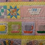 A close-up of Jane Regans quilt, My Mothers Trunk, one of the works in the 9 Women / 9 Quilts show that opened last Friday, Feb. 1, 2019, at the Homer Council on the Arts, in Homer, Alaska. Each panel or row of books was done by a different quilter using fabric from Regans mother. (Photo by Michael Armstrong/Homer News)