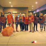 A group of teachers gather outside the entrance to West Homer Elementary and Big Fireweed Academy wearing red for ed Wednesday, in Homer. Teachers around the Kenai Peninsula demonstrated this week to bring awareness to the contract negotiation situation with the school district. (Photo by Megan Pacer/Homer News)