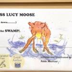 Local author Ann Mercers first book, Miss Lucy Moose Falls Down in the Swamp sits on the shelves of River City Books in Soldotna. (Photo by Brian Mazurek/Peninsula Clarion)