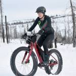 Amber Bethe pushes up a hill during Fat Freddies Bike Race and Ramble on Saturday, Feb. 9, 2019, in the Caribou Hills near Freddies Roadhouse. (Photo by Jeff Helminiak/Peninsula Clarion)