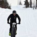 Mike Crawford barrels down a hill during Fat Freddies Bike Race and Ramble on Saturday, Feb. 9, 2019, in the Caribou Hills near Freddies Roadhouse. (Photo by Jeff Helminiak/Peninsula Clarion)