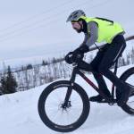 Nathan Kincaid flies down a hill during Fat Freddies Bike Race and Ramble on Feb. 9, 2019, in the Caribou Hills near Freddies Roadhouse. (Photo by Jeff Helminiak/Peninsula Clarion)