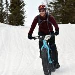 Ryan Peterson sails down a hill during Fat Freddies Bike Race and Ramble on Saturday, Feb. 9, 2019, in the Caribou Hills near Freddies Roadhouse. (Photo by Jeff Helminiak/Peninsula Clarion)
