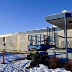 After construction workers removed siding from the facade of the Kenai Municipal Airport, a mural with iconic Kenai images like fishing nets, the St. Nicholas Russian Orthodox chapel and a dog musher, was revealed on Tuesday, Jan. 15, 2019 in Kenai, Alaska.(Photo by Victoria Petersen/Peninsula Clarion)