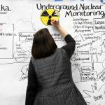 Anne M. Jess, of The Doodle Biz of Seattle, creates a graphic representation of a U.S. Department of Energy presentation addressing earthquake damage to some mud disposal sites and sampling results from radiologic monitoring on Amchitka Island during a forum Tuesday, in Anchorage. (AP Photo/Mark Thiessen)