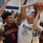 Soldotnas Jersey Truesdell (15) attempts a shot against Wasillas Daniel Headdings Friday night in a conference meeting at Soldotna High School. (Photo by Joey Klecka/Peninsula Clarion)