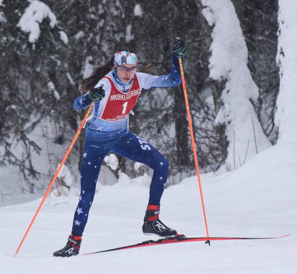 Soldotnas Erika Arthur powers her way up a hill Saturday afternoon at the Kenai Peninsula Borough nordic ski meet at the Tsalteshi Trails in Soldotna. (Photo by Joey Klecka/Peninsula Clarion)