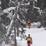 Kenais Jaala Lopez (left) leads teammate Abby Moffett during the second leg of Saturdays girls relay at the Kenai Peninsula Borough nordic ski meet at the Tsalteshi Trails in Soldotna. (Photo by Joey Klecka/Peninsula Clarion)