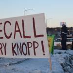 Protestors stand outside the town hall hosted by Rep. Gary Knopp, R- Soldotna at the Kenai River Suites in Soldotna on Feb. 15, 2019. (Photo by Brian Mazurek/Peninsula Clarion)