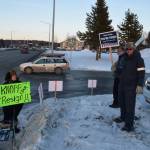 Protestors stand outside the town hall hosted by Rep. Gary Knopp, R- Soldotna at the Kenai River Suites in Soldotna on Feb. 15, 2019. (Photo by Brian Mazurek/Peninsula Clarion)
