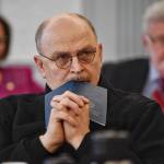 Sen. Click Bishop, R-Fairbanks, rests his head on a Constitution of Alaska booklet as he listens to Donna Arduin, Director of the Office of Management and Budget, and Mike Barnhill, policy director for the OMB, continue to present Gov. Mike Dunleavys budget to the Senate Finance Committee at the Capitol on Tuesday, Feb. 19, 2019. Senate President Cathy Giessel, R - Anchorage, left, and Sen. Gary Stevens, R-Kodiak, right, are in the background. (Michael Penn | Juneau Empire)