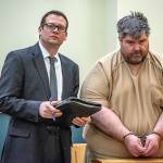 Steven Downs, 44, of Auburn, Maine, right, stands for his initial appearance in 8th District Court in Lewiston, Maine, on Tuesday. Downs has been charged with the 1993 rape and murder of 20-year-old Sophie Sergie at the University of Alaska Fairbanks. Standing with Downs is Attorney Richard Charest. (Andree Kehn/Sun Journal via AP)