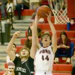 Nikiskis Cody Handley and Kenai Centrals Kaden McKibben battle for the rebound Tuesday, Feb. 19, 2019, at Kenai Central High School. (Photo by Jeff Helminiak/Peninsula Clarion)