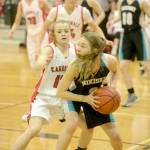 Nikiskis America Jeffreys faces pressure from Kenai Centrals Hayley Maw on Tuesday, Feb. 19, 2019, at Kenai Central High School. (Photo by Jeff Helminiak/Peninsula Clarion)