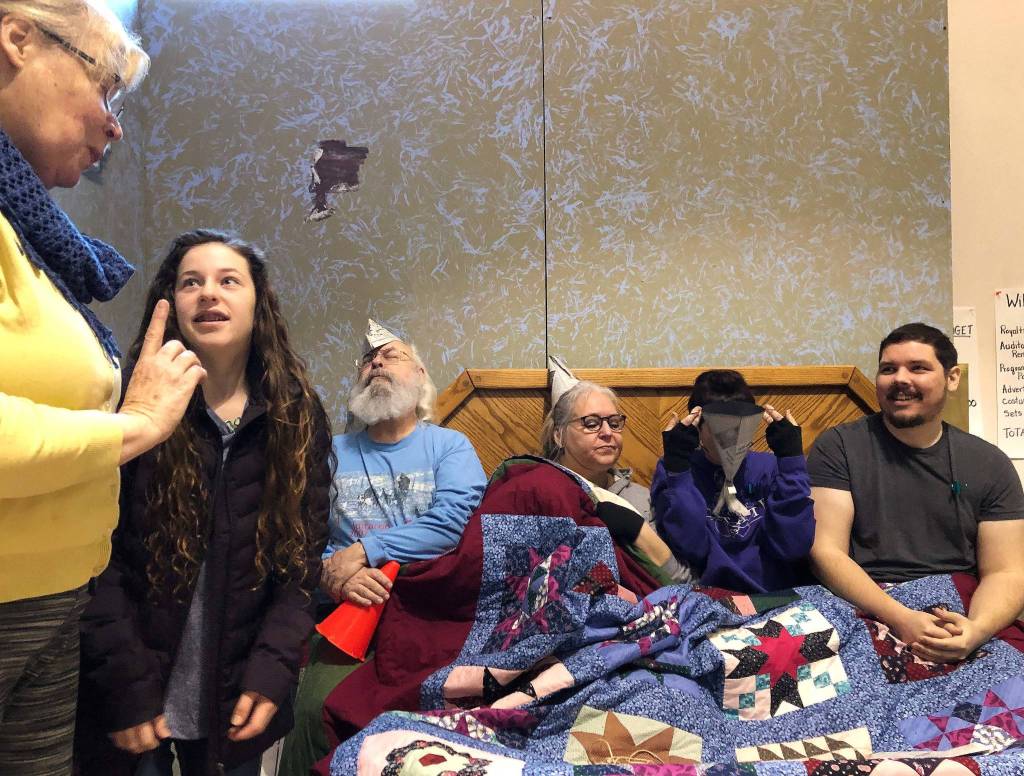 Clare Henry (second from left) plays the role of Charlie Bucket, and is joined by (left to right) Rob Lewis, Cheri Johnson, Yvette Tappana and Ken Duff during rehearsal Feb. 9 at the Kenai Performers building in Soldotna. (Photo by Joey Klecka/Peninsula Clarion)