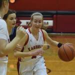 Kenais Jaycie Calvert drives into the paint against Soldotnas Morgan Bouschor Saturday in a nonconference clash at Kenai Central High School. (Photo by Joey Klecka/Peninsula Clarion)