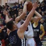 Kenais Adam Trujillo puts up a shot against Soldotnas Brock Kant (20) Saturday in a nonconference clash at Kenai Central High School. (Photo by Joey Klecka/Peninsula Clarion)