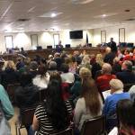 Residents pack into the Kenai Peninsula Borough Betty J. Glick Assembly Chambers for a chance to hear and speak with R-Sen. Peter Micciche (Kenai/Soldotna) and R-Rep. Ben Carpenter (Nikiski) at a town hall meeting, Saturday, Feb. 23, 2019, in Soldotna, Alaska. (Photo by Victoria Petersen/Peninsula Clarion)